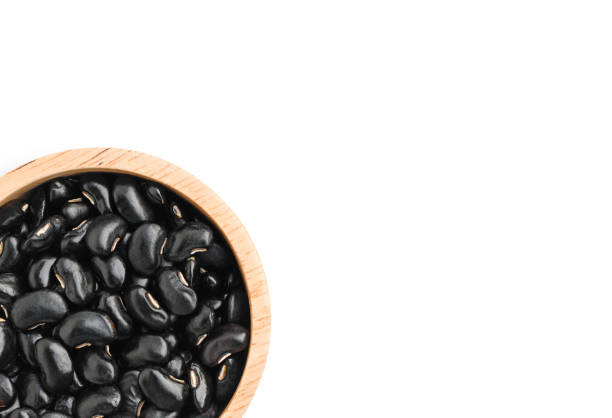 istock black beans in wooden bowl isolated on white 1324145448