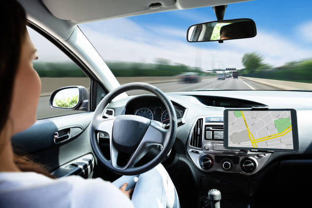 Woman Traveling By Self Driving Car Close-up Of A Woman Traveling By Self Driving Modern Car driverless car stock pictures, royalty-free photos & images
