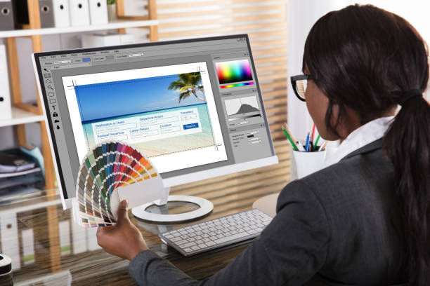 istock Female Designer Holding Colorful Swatch Working On Computer 1324148019