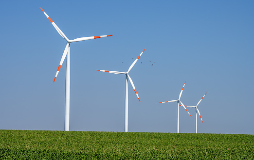 Modern wind turbines in a grainfield seen in Germany