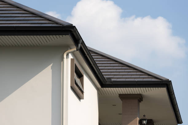 istock rain gutter on the house roof with down pipe. 1324152913