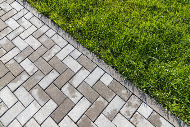 istock Cobbled road and green grass. Top view, background 1324155080