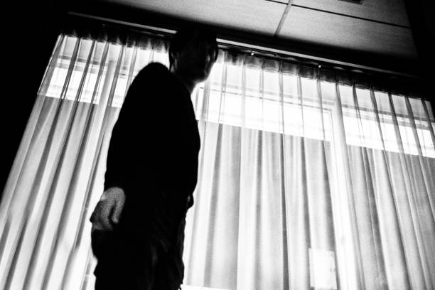 Man standing in the room Man standing in the room. creepy stalker stock pictures, royalty-free photos & images