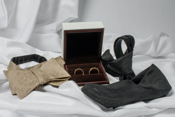 istock LGBTQIA wedding. Wedding rings and tie, bow tie. 1324157189