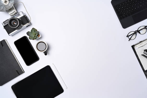 istock Mock up smart phone, tablet, camera and notebook on white background. 1324157814