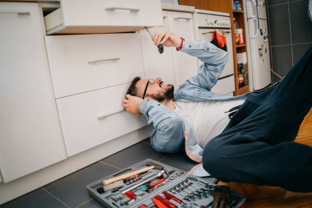 istock Repairman repairs the kitchen, the drawer 1324159216