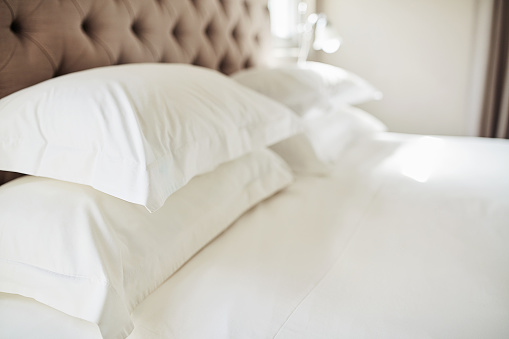 Shot pillows on a bed in a modern hotel