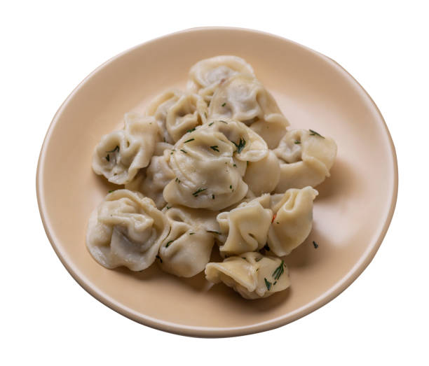 istock dumplings on a plate isolated on white background .meat dumplings top view . 1324159925
