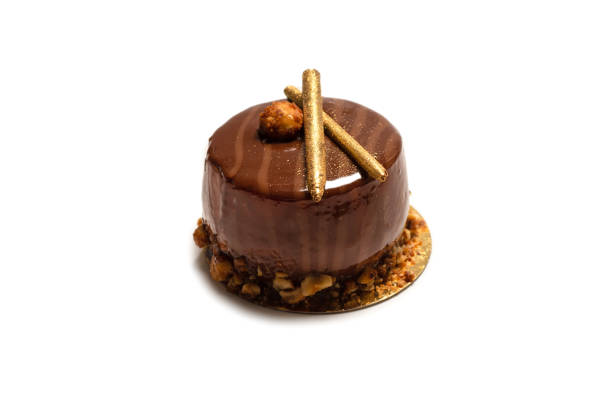 istock Chocolate and caramel cake isolated on a white background. 1324161247