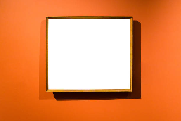 narrow wooden picture frame on orange wall