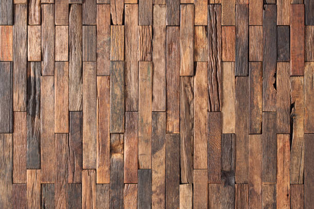 istock surface of wall panel made boards as a background. brown wood texture 1324161645