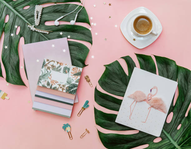 istock Flat lay woman Pink tropical office desk table with notebook, computer keyboard and coffee. Creative blogger concept 1324162885
