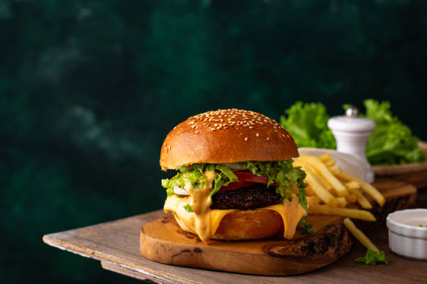 istock Cheeseburger with beef cutlet and vegetables 1324163260