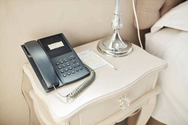 Close-Up Of Rotary Phone On Table At Home