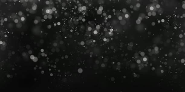 istock Christmas glowing light bokeh confetti and spark overlay texture for your design 1324164400