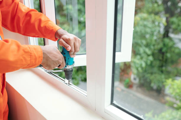 istock Driving screws into jamb of plastic window 1324165687
