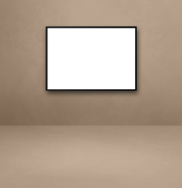 istock Black picture frame hanging on a beige wall 1324166406