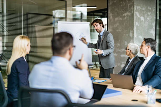 istock Young businessman leading a presentation in the office. 1324166883
