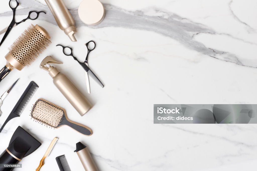 Hair cutting tools and accessories on marble background with space Hair Salon Stock Photo