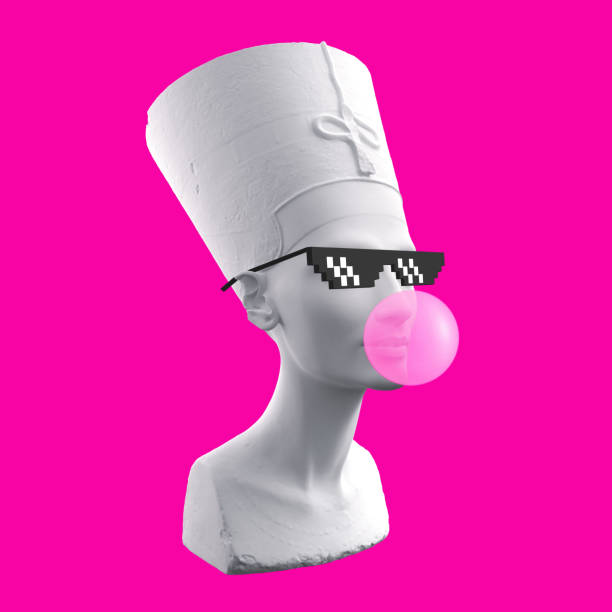 istock Funny illustration from 3d rendering ofhead sculpture Nefertiti in pixel glasses, blowing a pink chewing gum bubble. Isolated on pink background. 1324171213