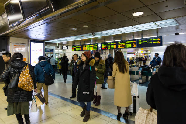 Sapporo,Japan-December 26,2017: many Crowed people walking from Sapporo JR train station during peak hour, Image slightly motion blur and noise