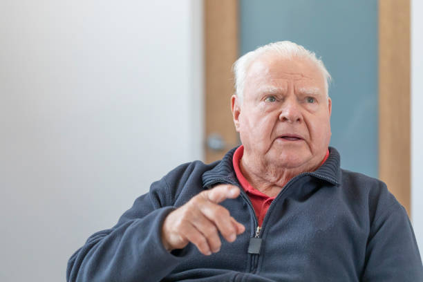 istock Senior Man Sitting at Home 1324171477