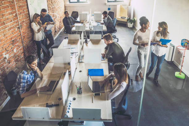 istock Above view of business people working at corporate office. 1324171721