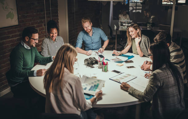 istock Large group of business people working on reports in the office. 1324171876