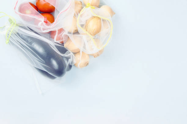 istock Zero waste. Vegetables in grocery bags on a gray background, copy space 1324172602