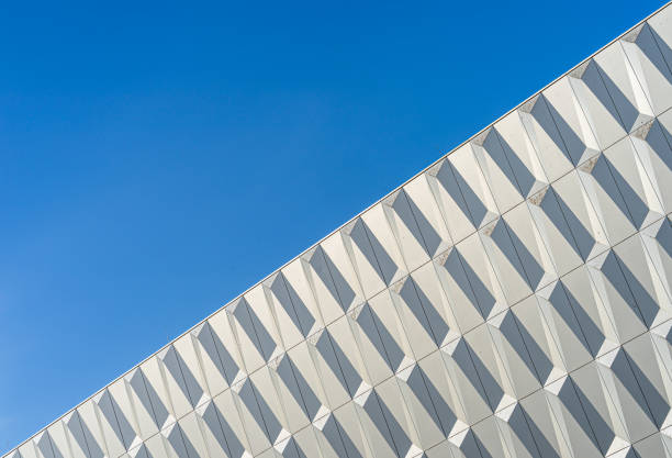istock Low Angle View Of Modern Building Against Clear Blue Sky 1324173115