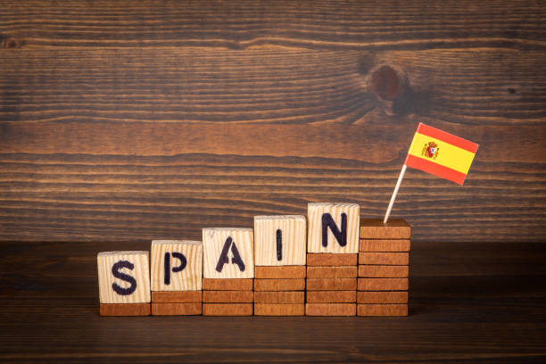 istock Spain. Wooden alphabet cubes on a wooden background 1324176406