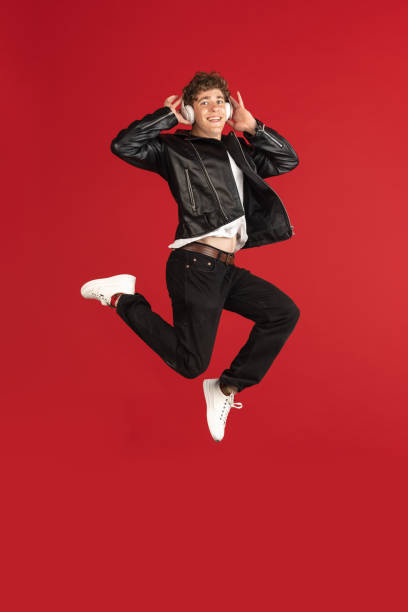 istock Male portrait isolated over red studio background with copyspace 1324176529