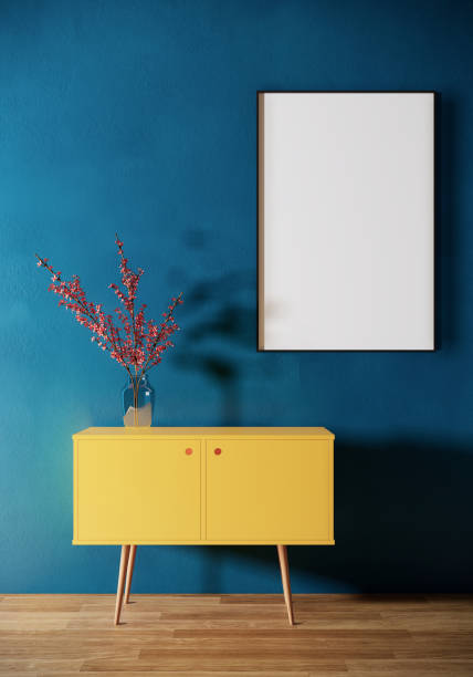 istock Blank picture frame mock up and yellow cabinet on blue wall, Room interior design, 3d rendering 1324177442