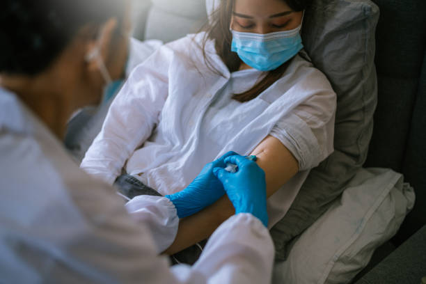 istock The doctor prepares the syringe for vaccination 1324182335