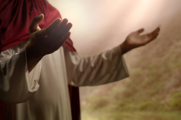 Jesus Christ praying to god Jesus Christ praying to god with sunlight background symbols of peace photos stock pictures, royalty-free photos & images