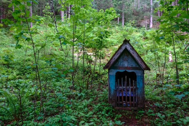 istock nice old wayside shrine in the green forest 1324189177