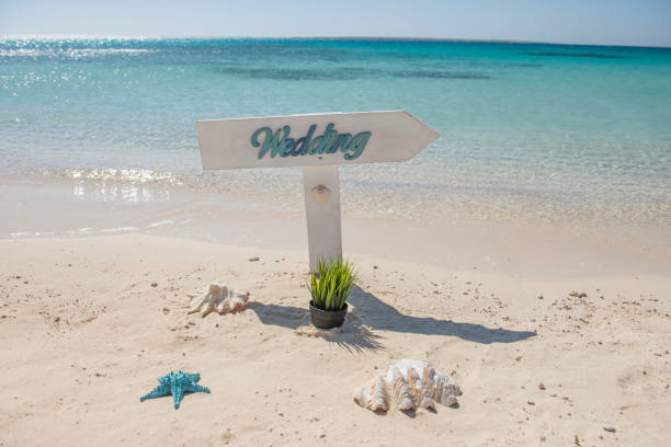 istock Wedding sign on a tropical beach paradise 1324190382