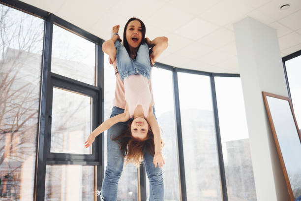 istock Young mother with her daughter spending weekend together on bed 1324191234