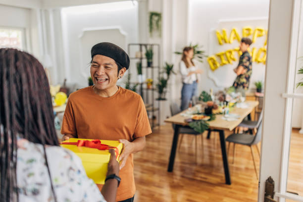 istock Friends bringing birthday presents 1324192387