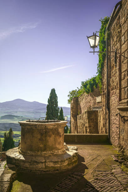Pienza town, picturesque old well and panoramic view. Tuscany, Italy, Europe