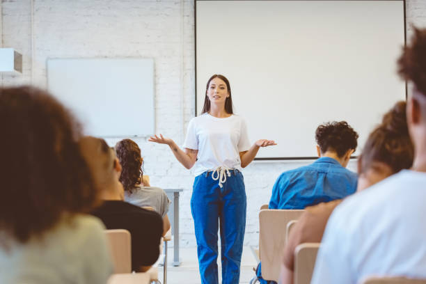 istock Female student giving presentation in classroom 1324194617