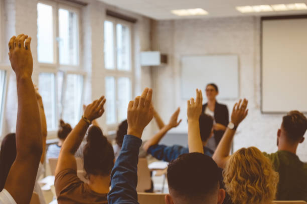 istock Students answering to teacher during lecture 1324195947