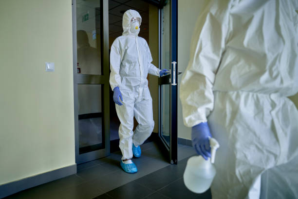 istock Worker in a protective suit after disinfecting the building 1324197955