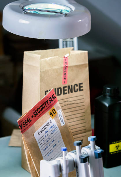 istock Files and evidence bag in a crime lab, conceptual image 1324198049