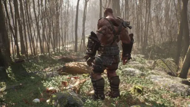 A formidable orc warrior trains before battle and demonstrates combat skills. Fantasy medieval concept. View of the fighting orc warrior in the fabulous green forest.