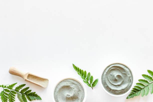 istock Blue clay cosmetic powder and mask in bowls. Top view 1324200469