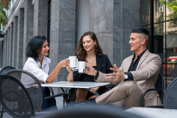 istock Multi-Ethnic business people discussing with colleagues at coffee breaks in pavement cafes 1324200805