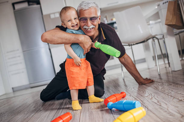 istock Grandfather and grandson playing 1324201739