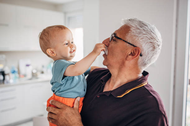 istock Grandfather holding grandson 1324202295