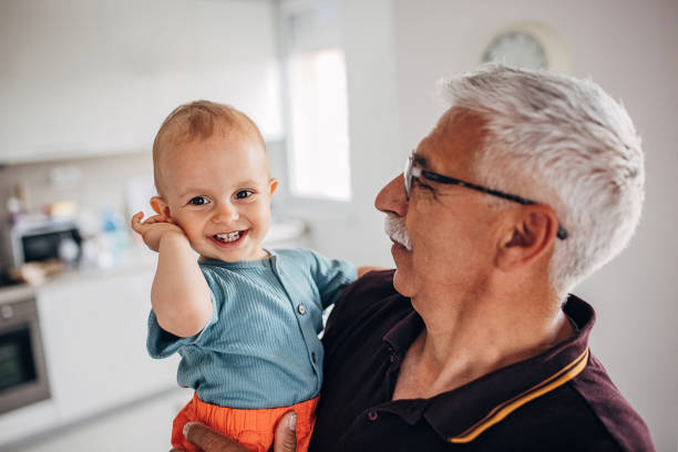 istock Grandfather holding grandson 1324202339